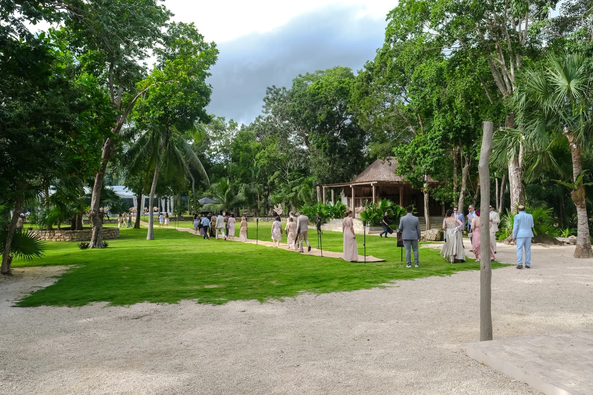 Wedding party walking on the lawn at Onze Xpuha, Signature Day Rental celebration