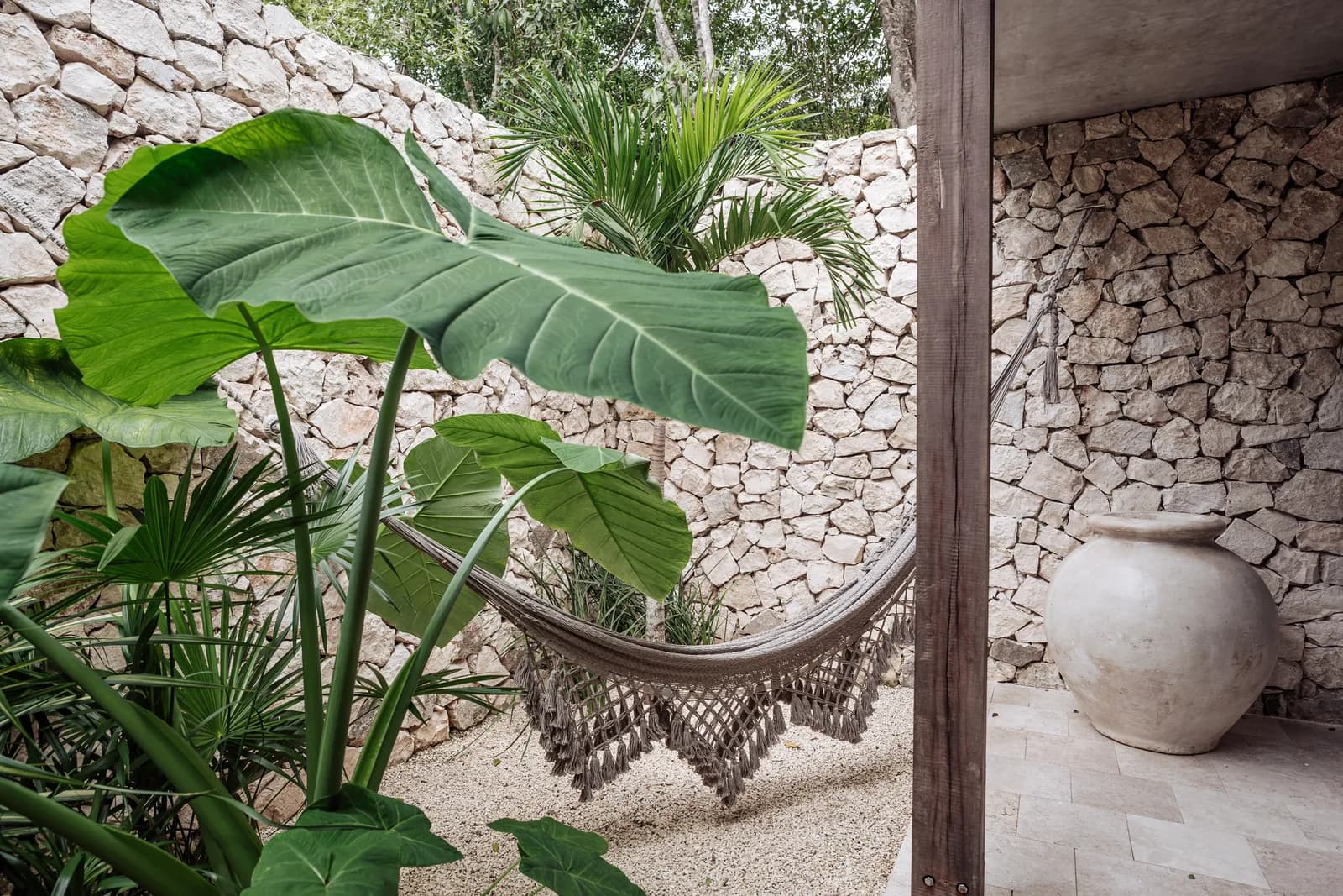 Villa 4 outdoor shower with hammock and stone wall